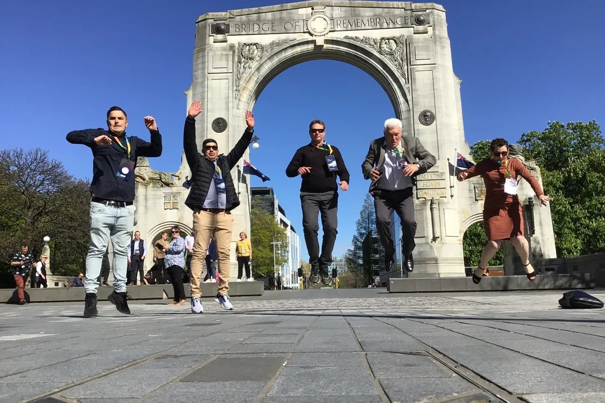 The Events Group jumping outside the Bridge of Remembrance