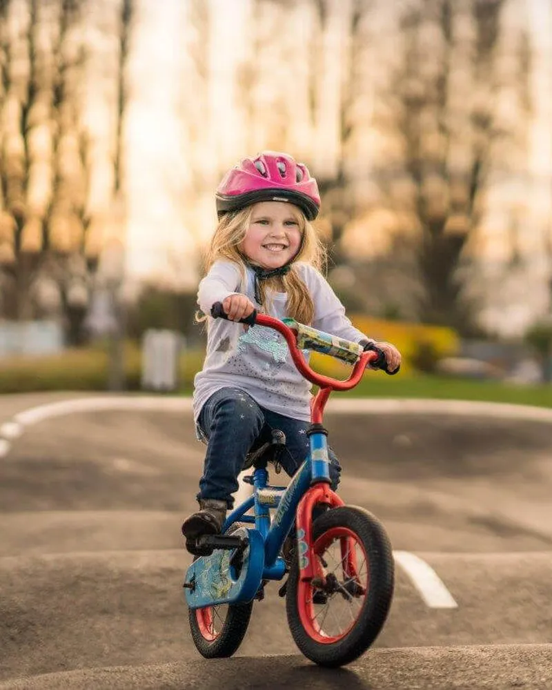 Girl riding bike on pump track