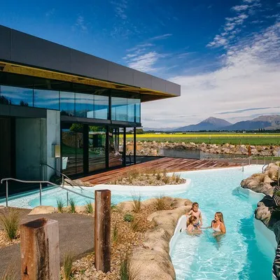 A family enjoying the opuke hot pools