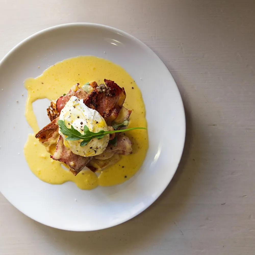 Overhead shot of eggs benedict on plate