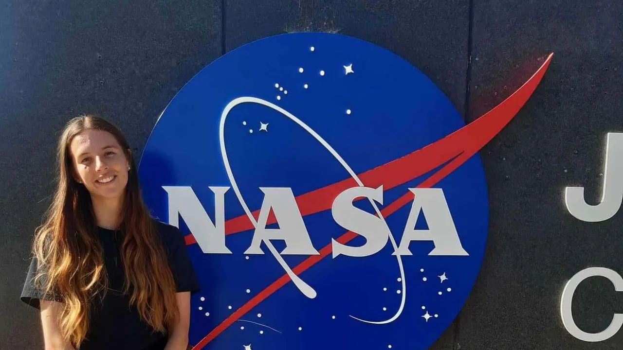 Leah Albrow in front of Nasa sign