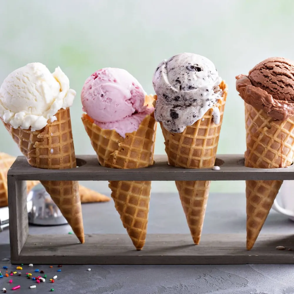 Four gelato ice creams in a cone in an ice cream stand