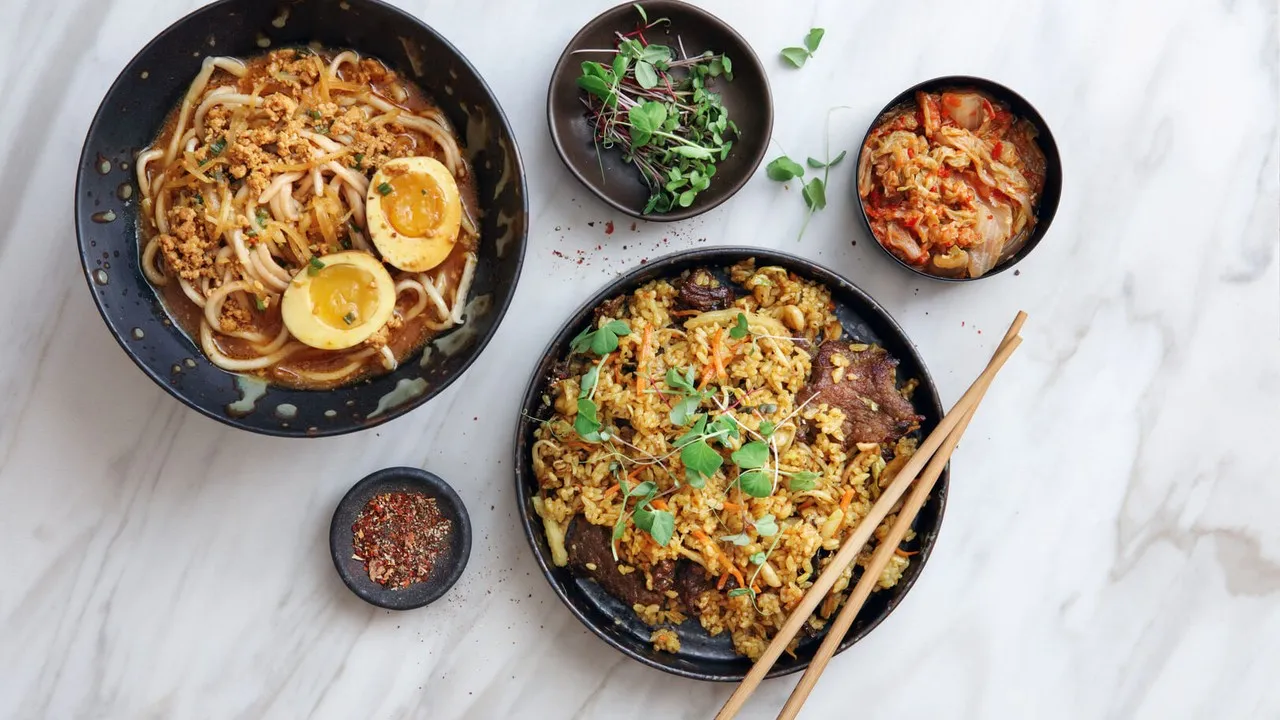 Noodles and rice dishes on table