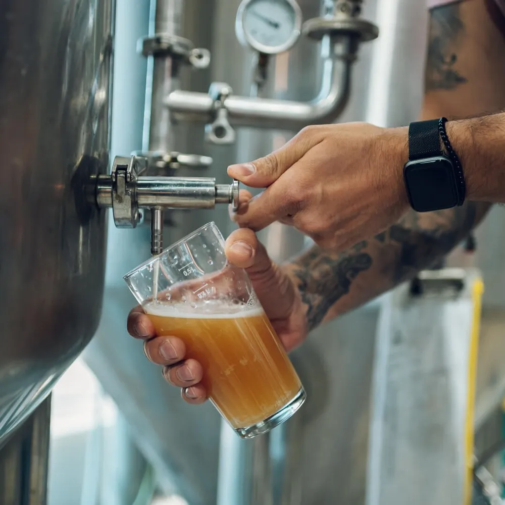 Pouring beer at a brewery