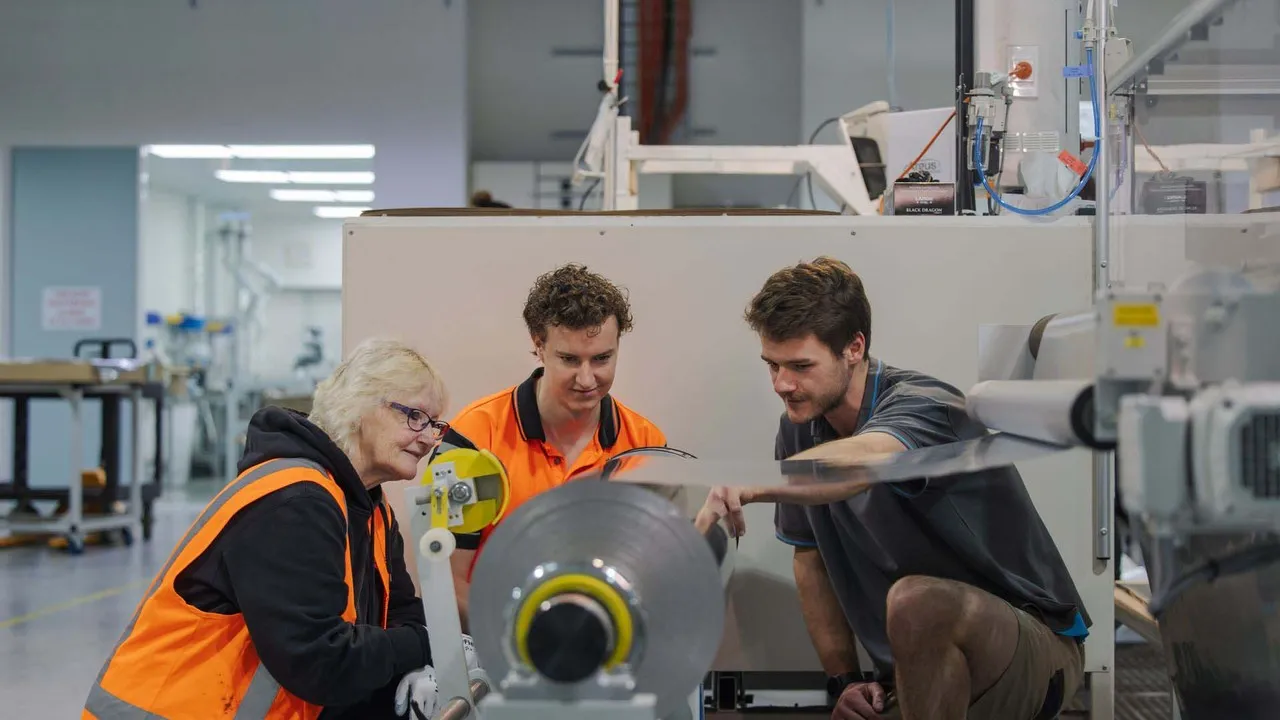 Caliber Design engineers checking machine