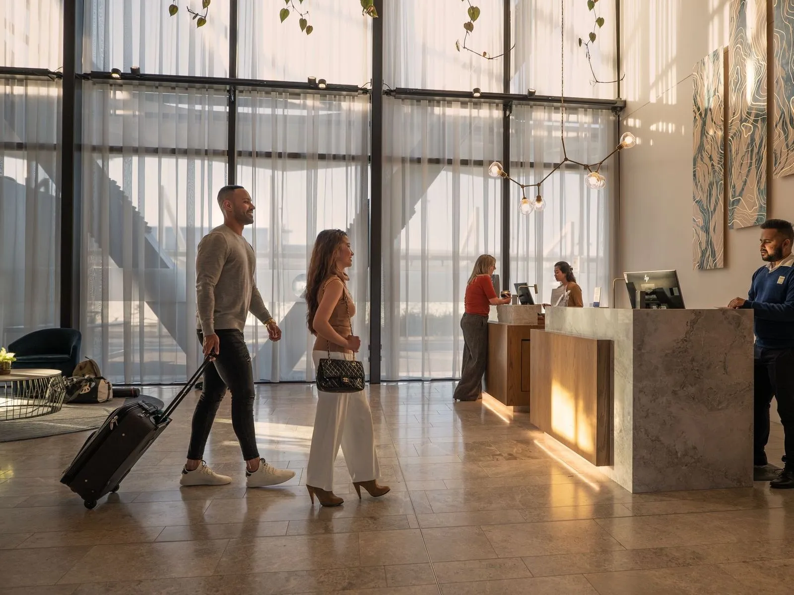 Couple checking into a Christchurch hotel