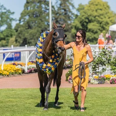 Lady with horse at the races