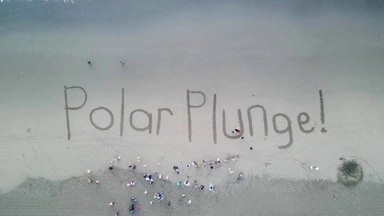 Polar Plunge written in the sand at New Brighton beach