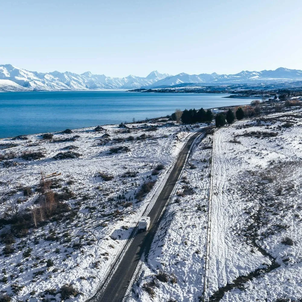 Camper driving to Laketown in snow