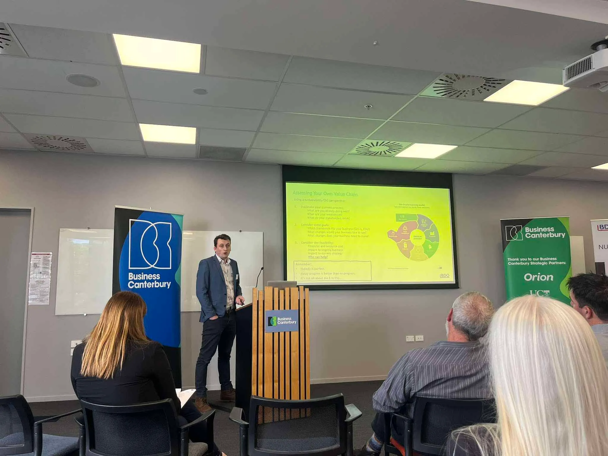 Man speaking at sustainability conference