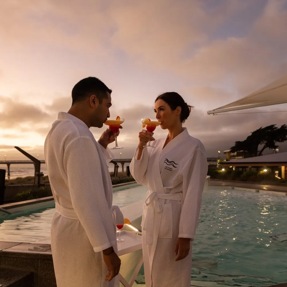 Couple enjoying the Sunrise Soak at He Puna Taimoana.