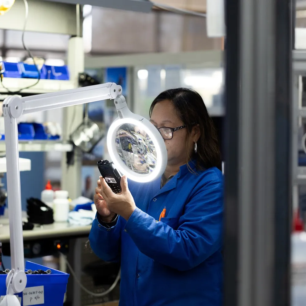 Looking at manufacturing product under mirror.