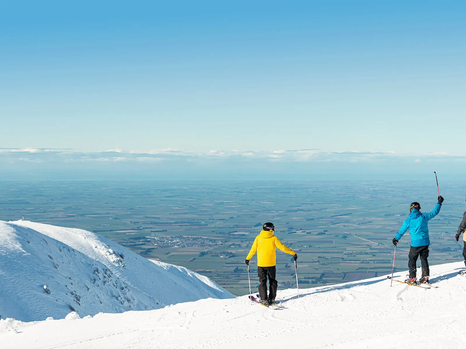 Skiers enjoying the view from Mt Hutt