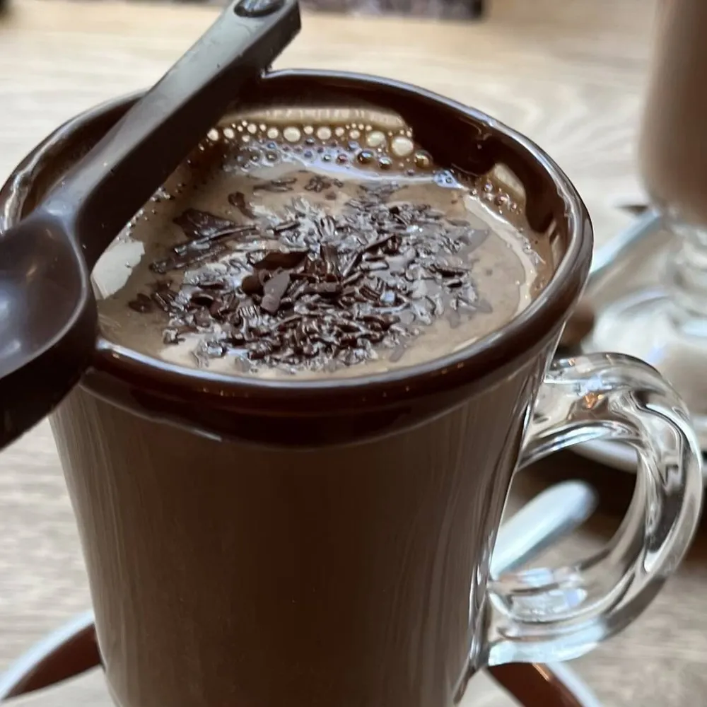 Dark hot chocolate from She Universe with chocolate spoon