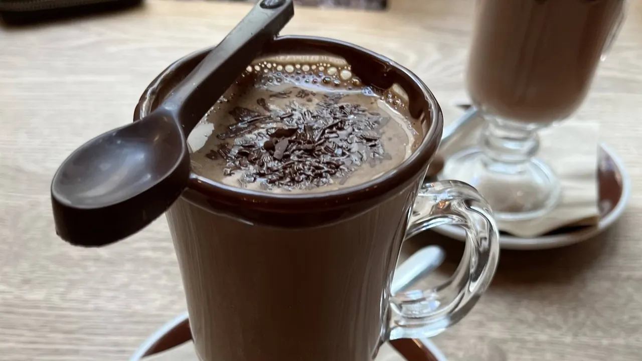 Dark hot chocolate from She Universe with chocolate spoon