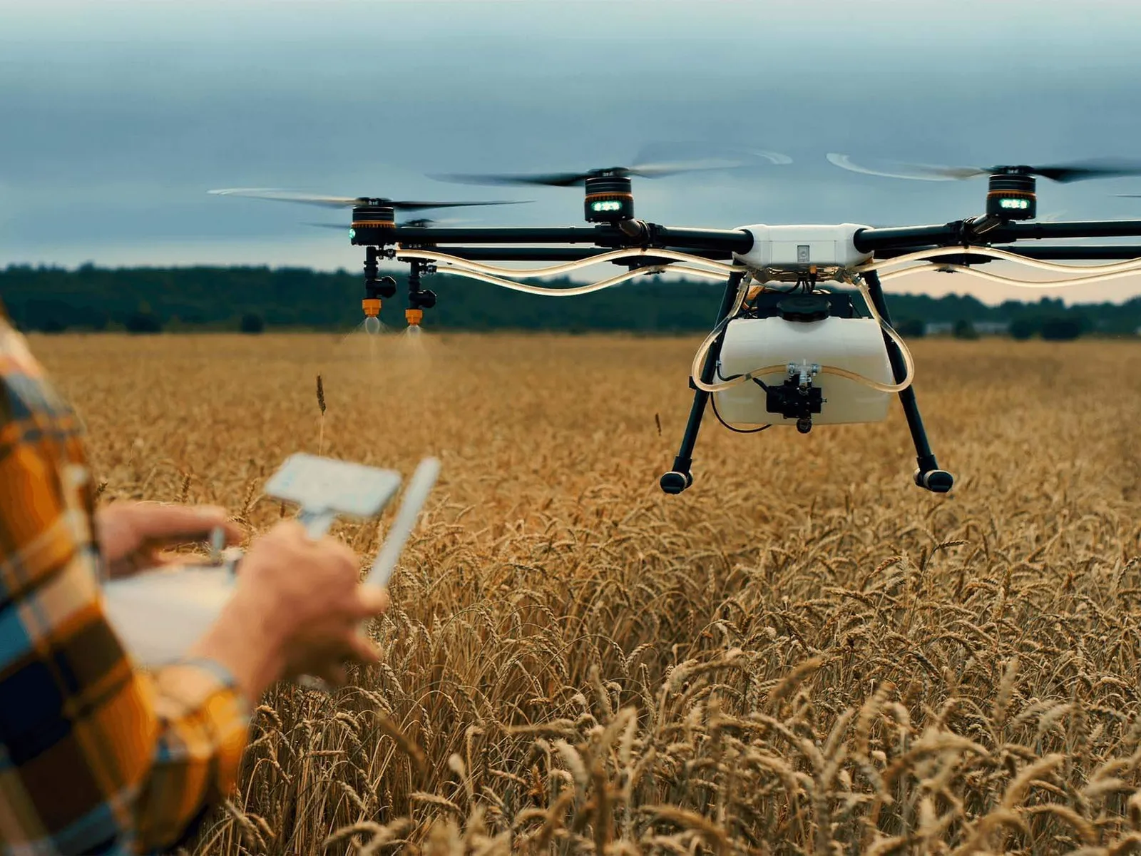 Man using a drone to check out crops on a farm