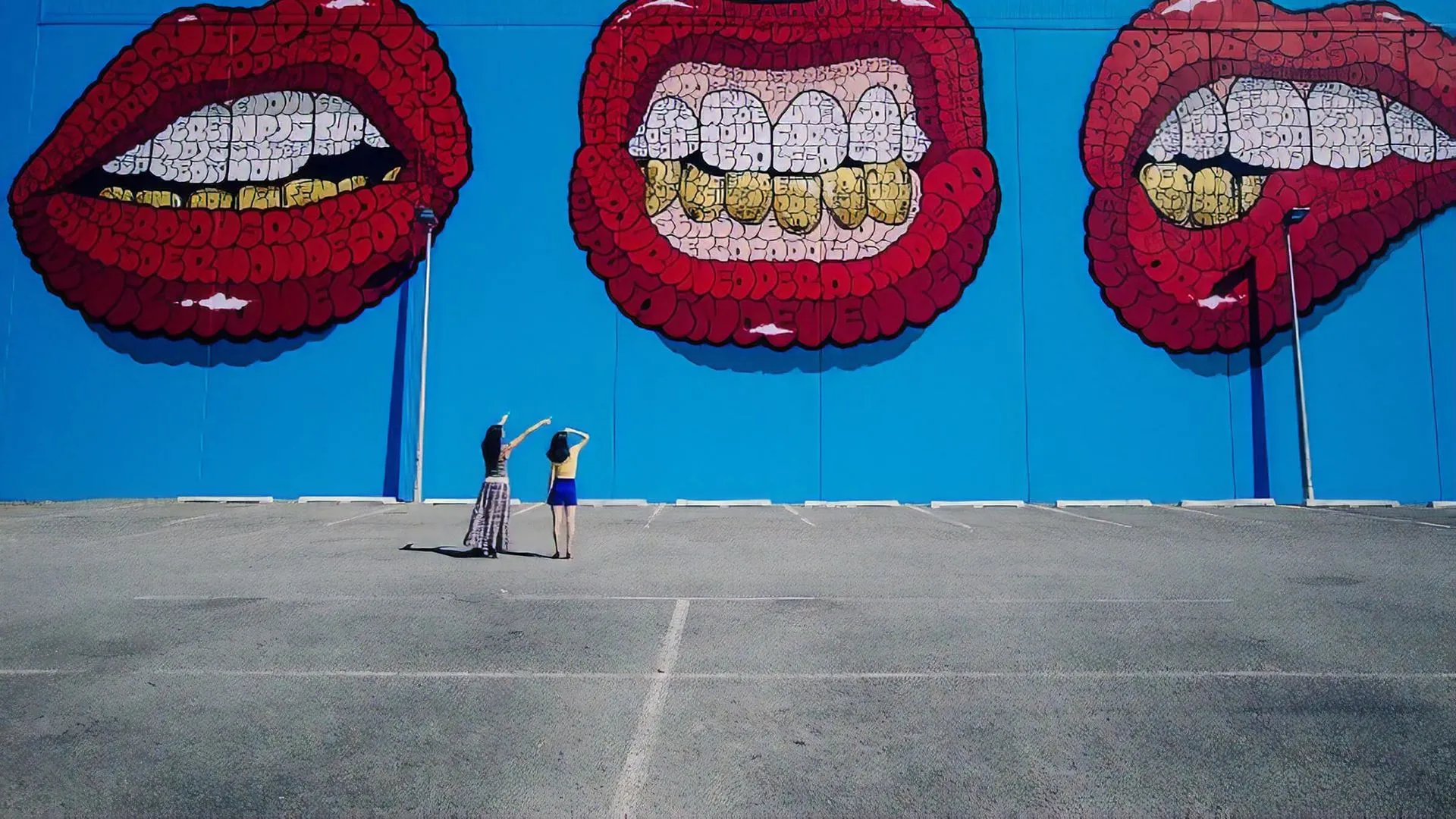 Large street art in Christchurch of lips and gold teeth