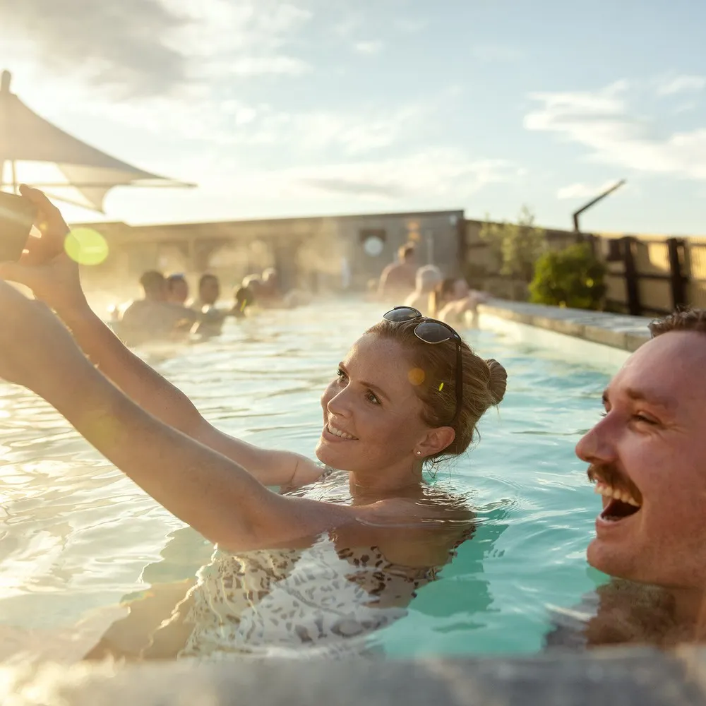 He Puna Taimoana couple taking selfie in the pool