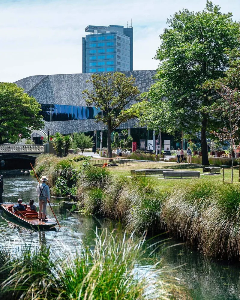 Punting on the Avon in front of Te Pae Convention Centre.