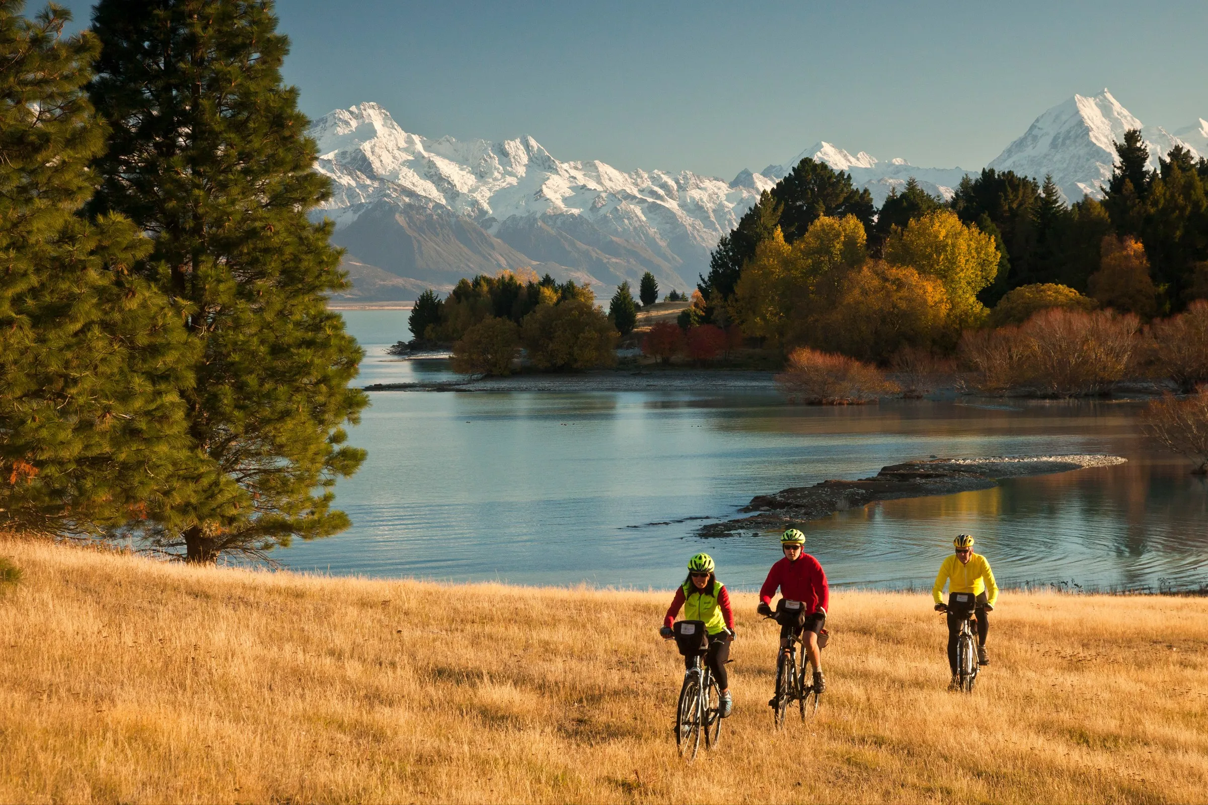 Three people biking on the Ocean to Alps cycle track