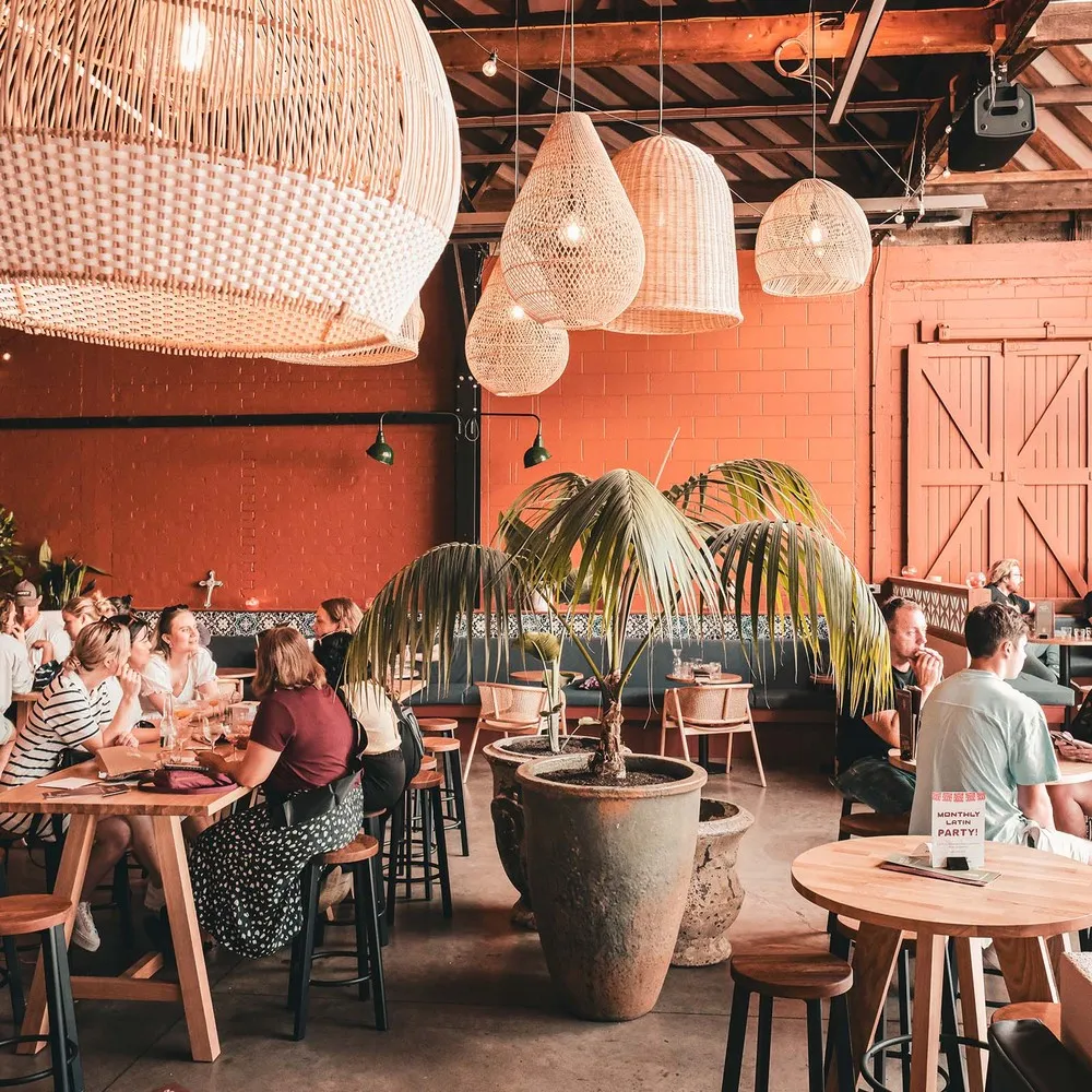 Patrons sitting at tables at Muy Muy