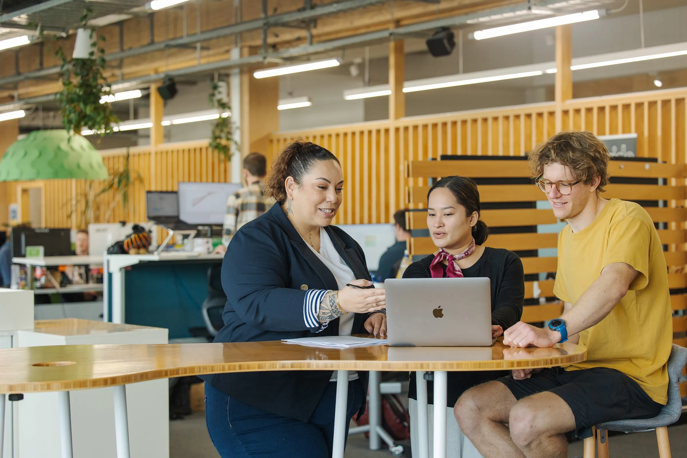 Three people having a meeting.