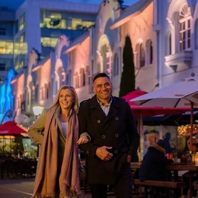 Couple walking down New Regent Street at night