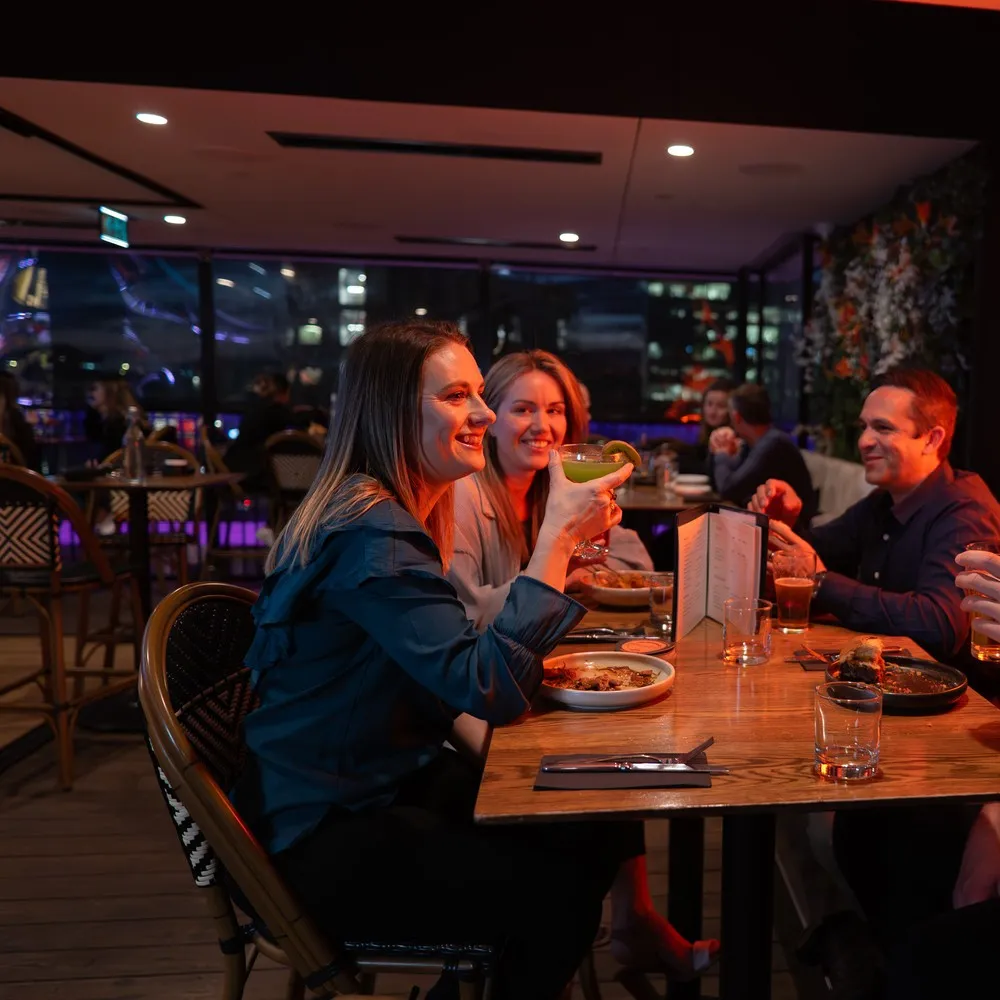 A group of friends enjoying dinner at Mr Brightside.