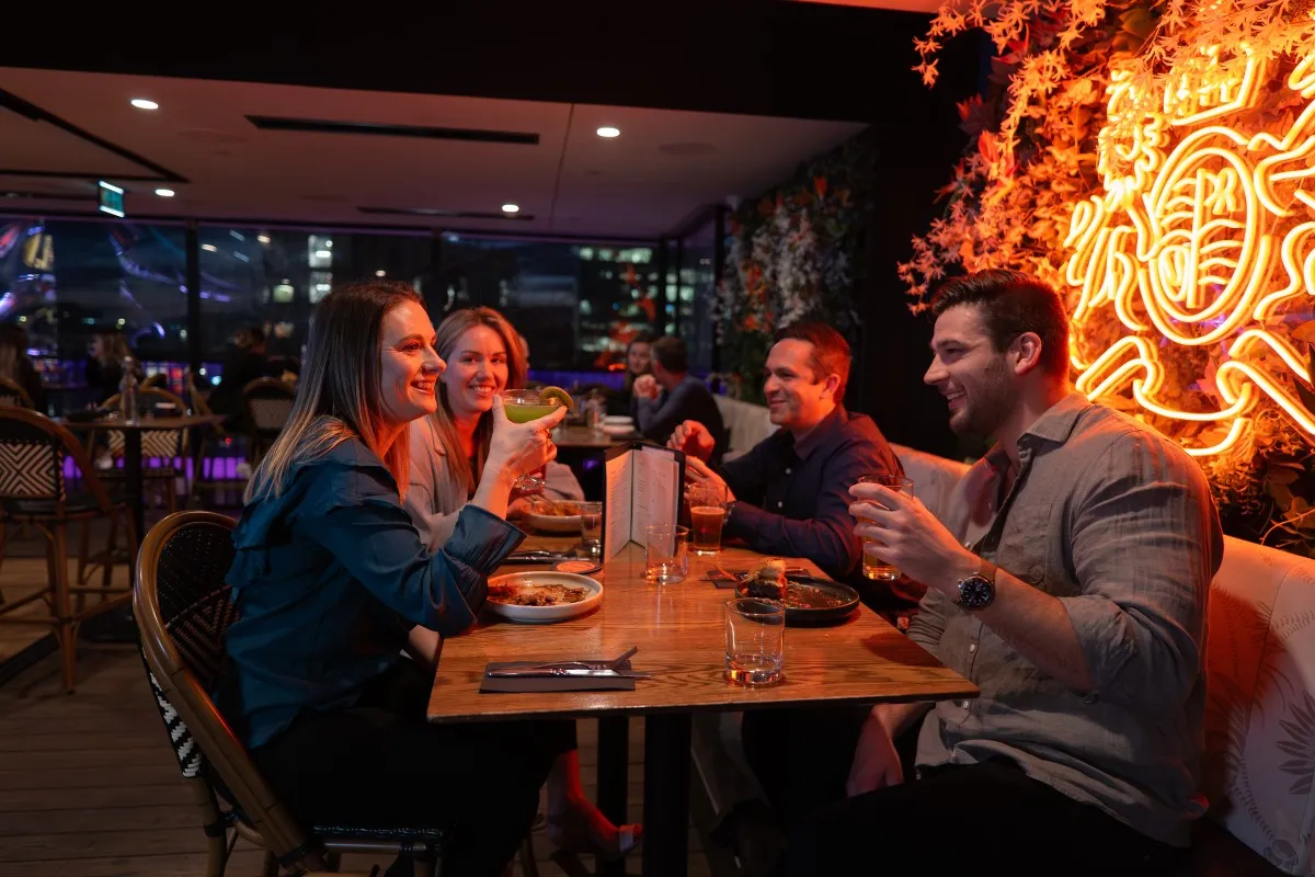 A group of friends enjoying dinner at Mr Brightside.