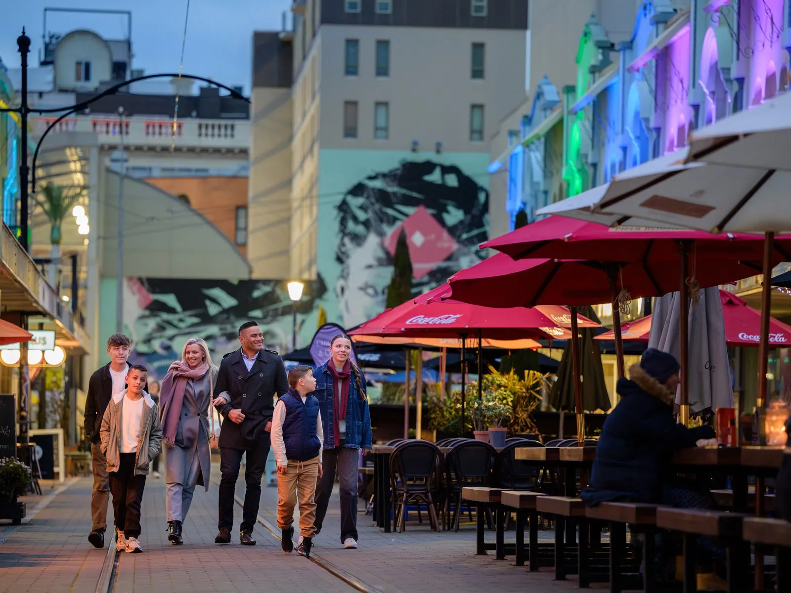 Family Walking Down New Regent Street In The Evening.