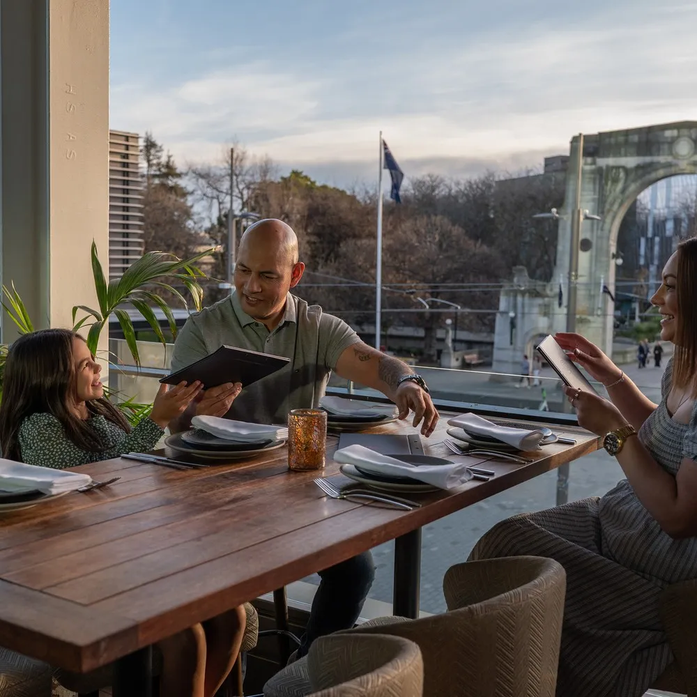 Family enjoying a meal at King Of Snake.