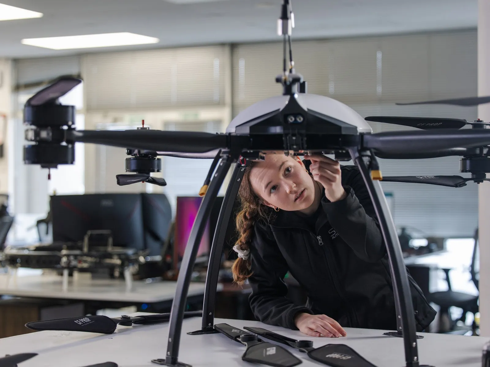 Lady working on a drone.