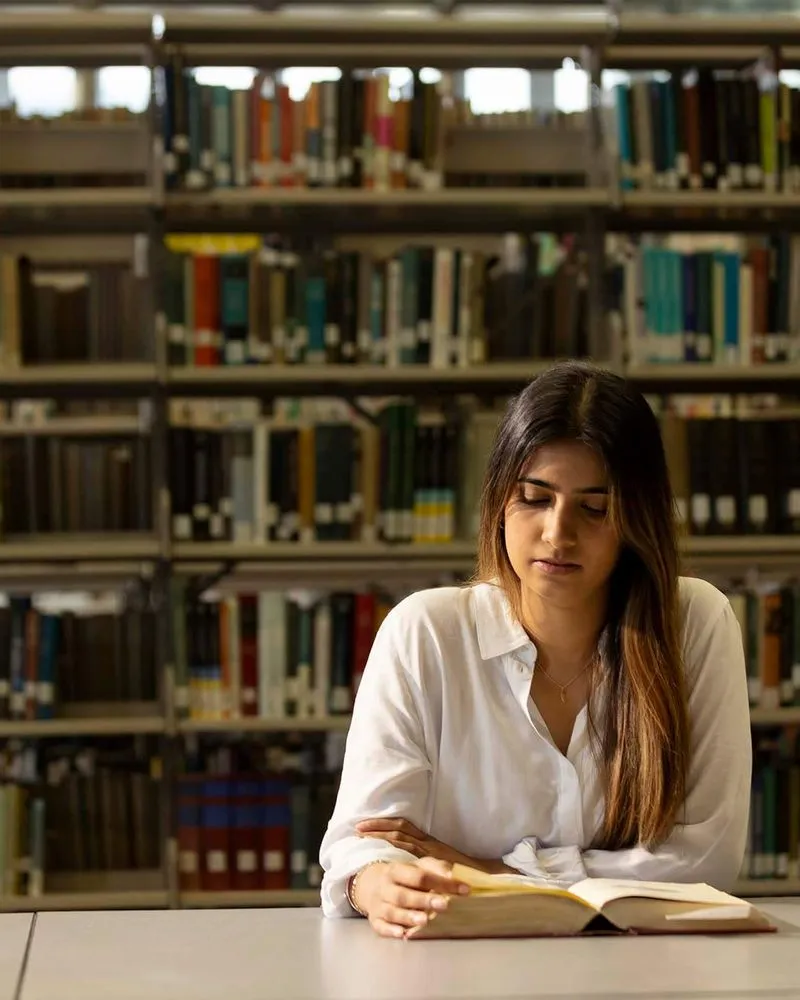 Girl studying in the library.