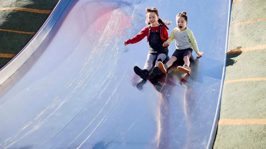 Children on slide at Margaret Mahy
