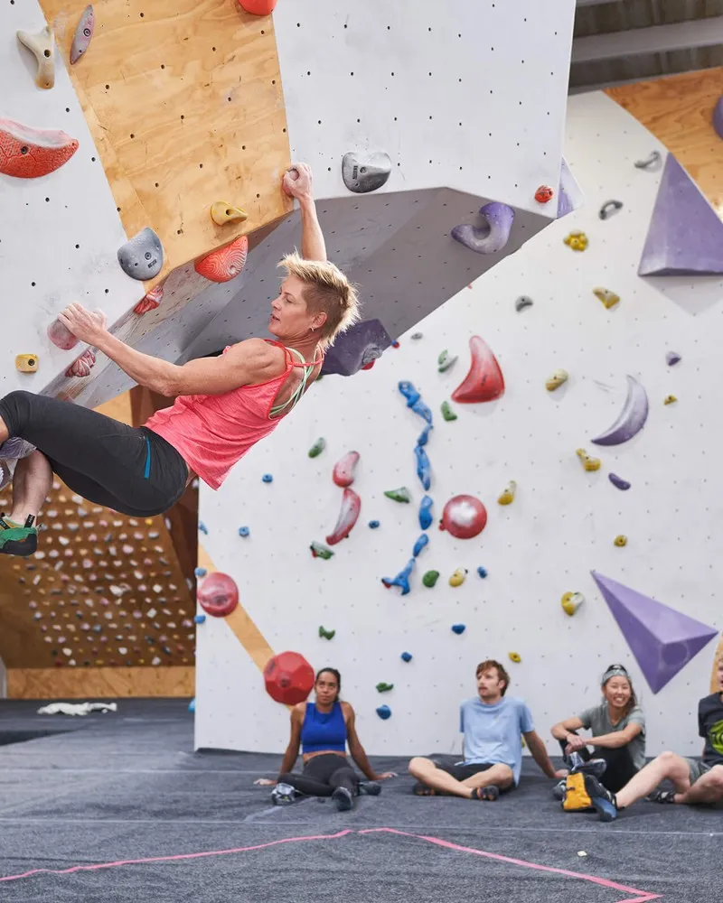 Person rock climbing at Uprising
