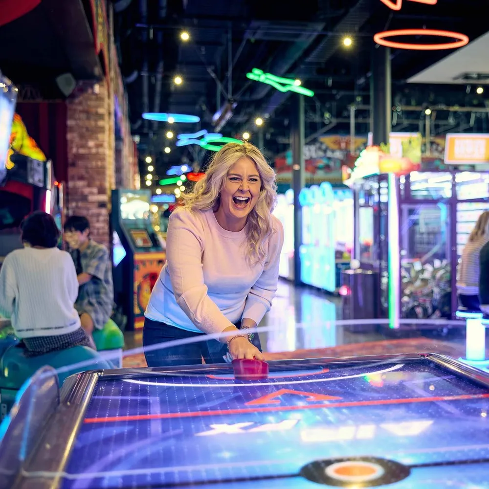 Having Fun Playing Air Hockey At Archie Brothers Christchurch.