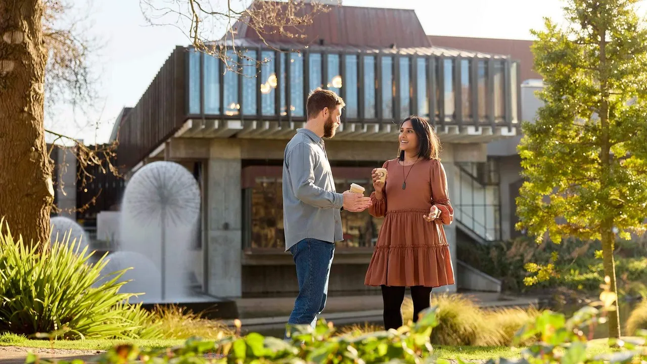 Two people outside the Town Hall