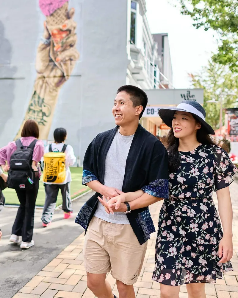 A couple enjoying a stroll down city mall Cashel Street Christchurch.
