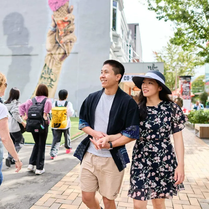A couple enjoying a stroll down city mall Cashel Street Christchurch.