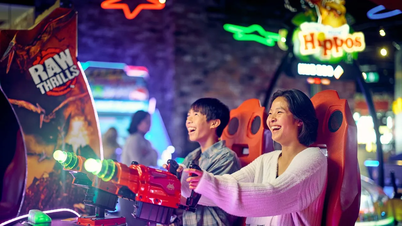 Teens enjoying arcade games at Archie Brothers.