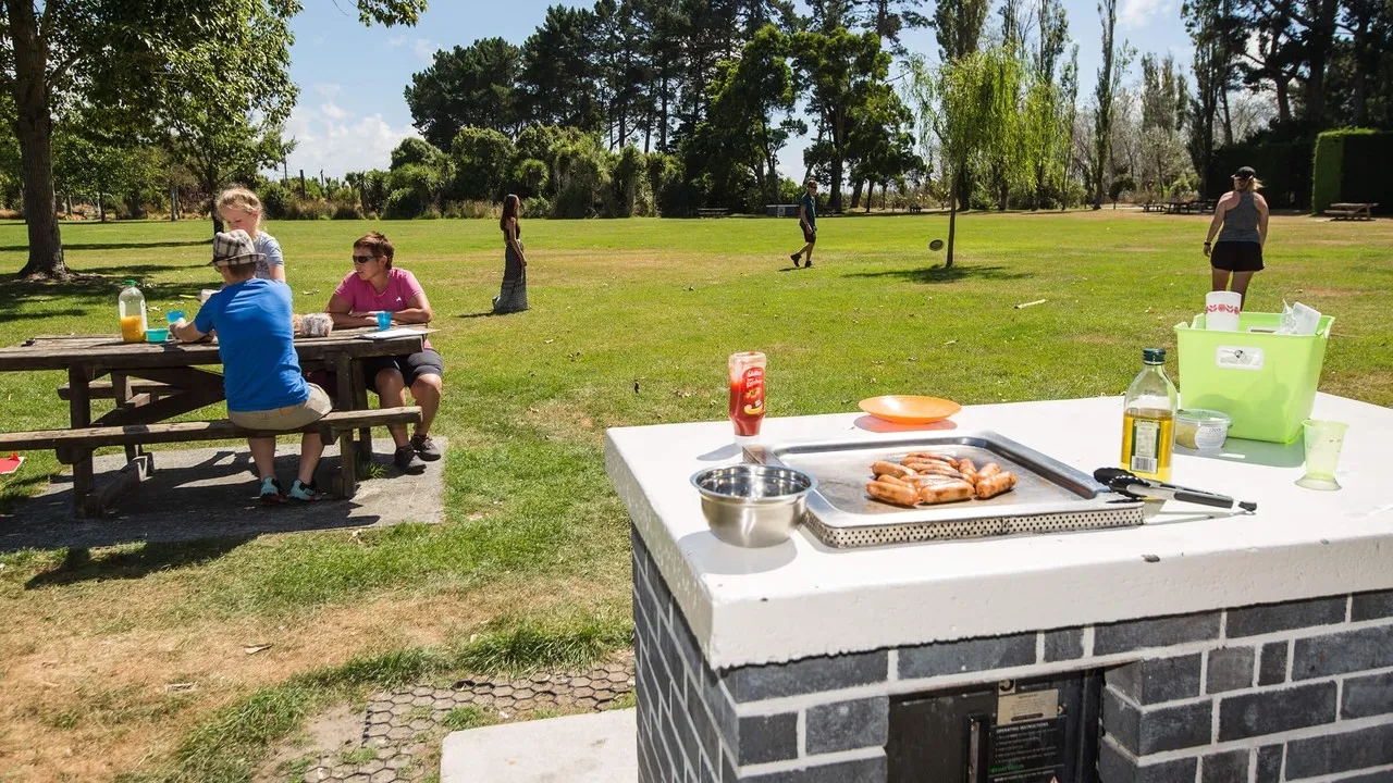 People enjoying an outdoor BBQ at Spencerville