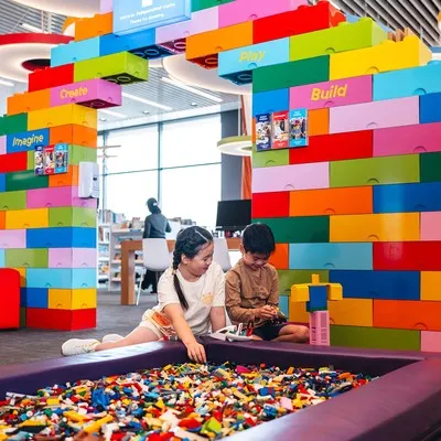 Children playing with lego at the Imagination Station at Tūranga.