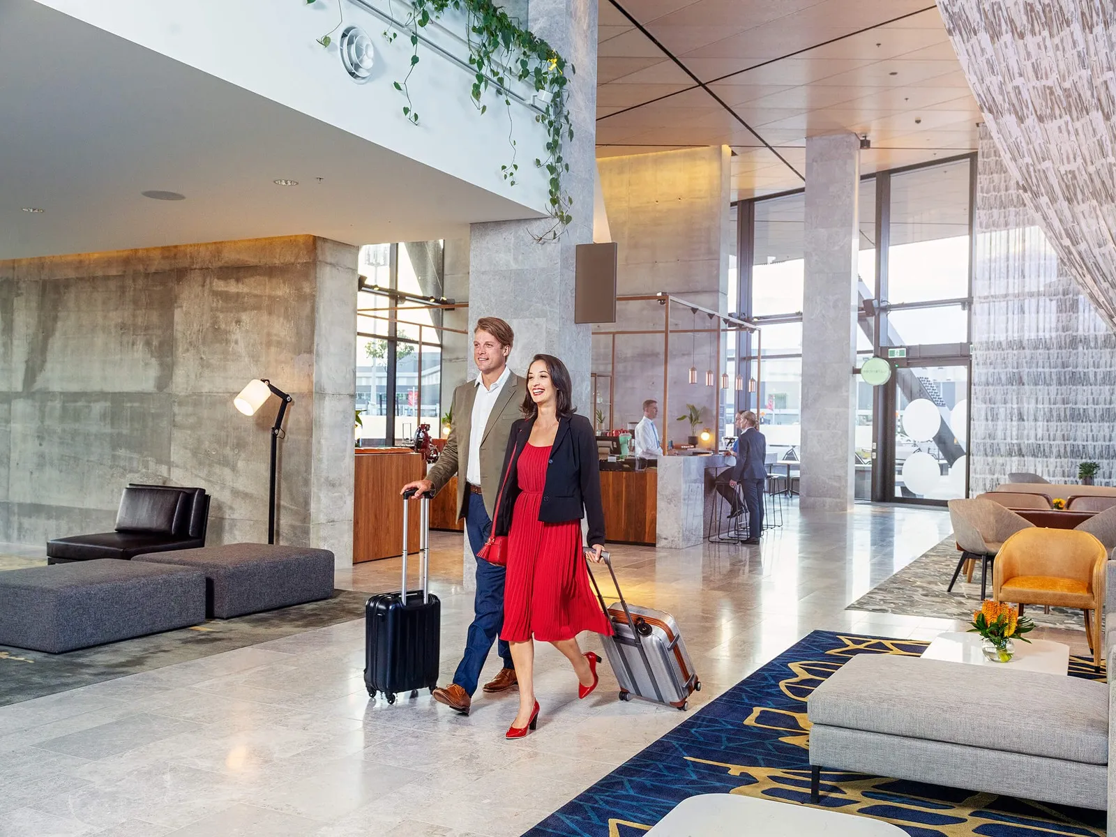 Couple checking into the Novotel Christchurch Airport.