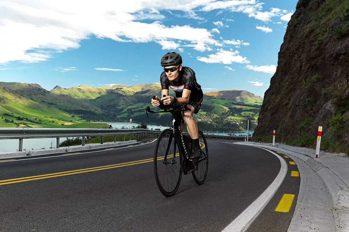 Cyclist road cycling on the Summit Road, Port Hills Christchurch.