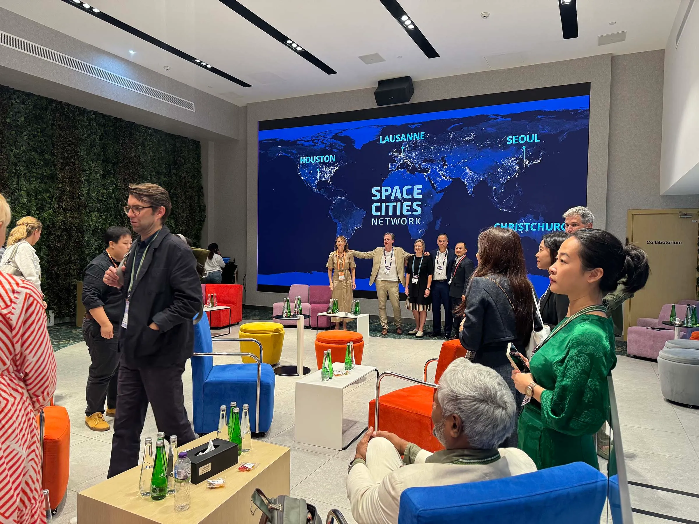 4 representatives from the space cities network lining up for a photo