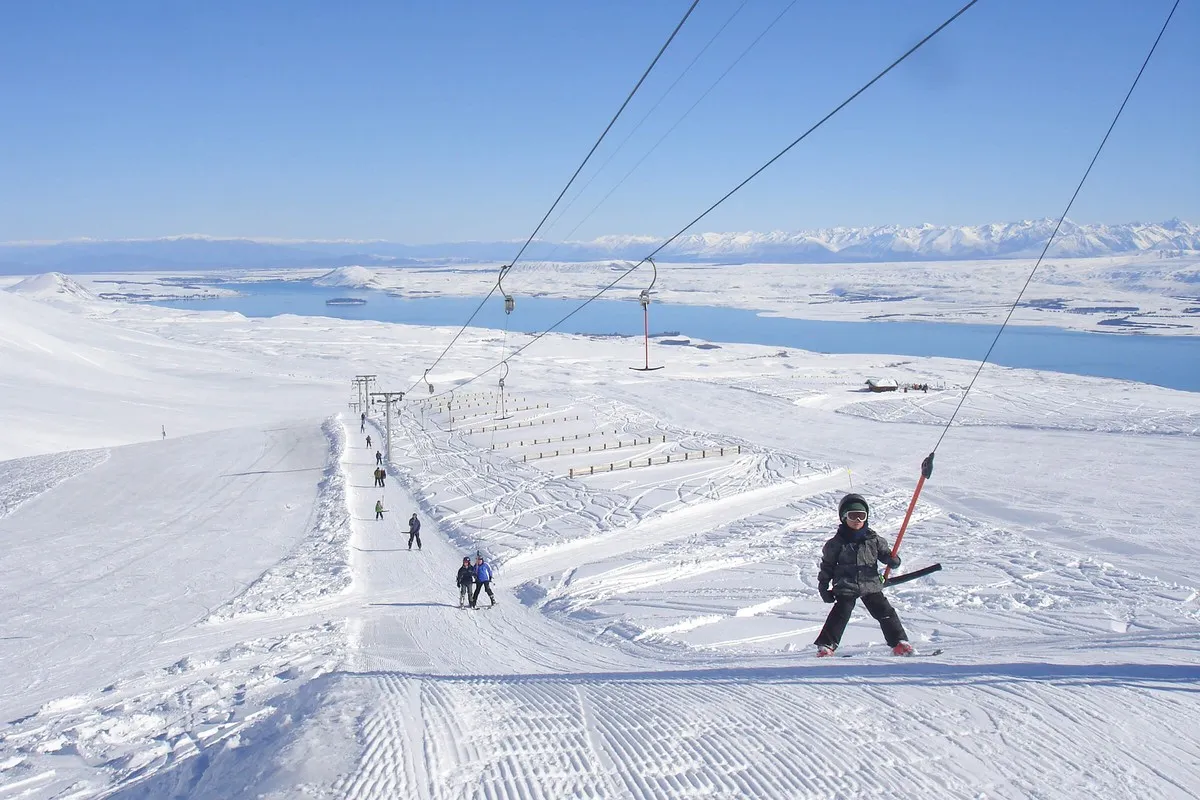 Family riding ski lift at Roundhill