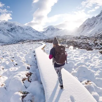Woman walking the hooker valley in winter