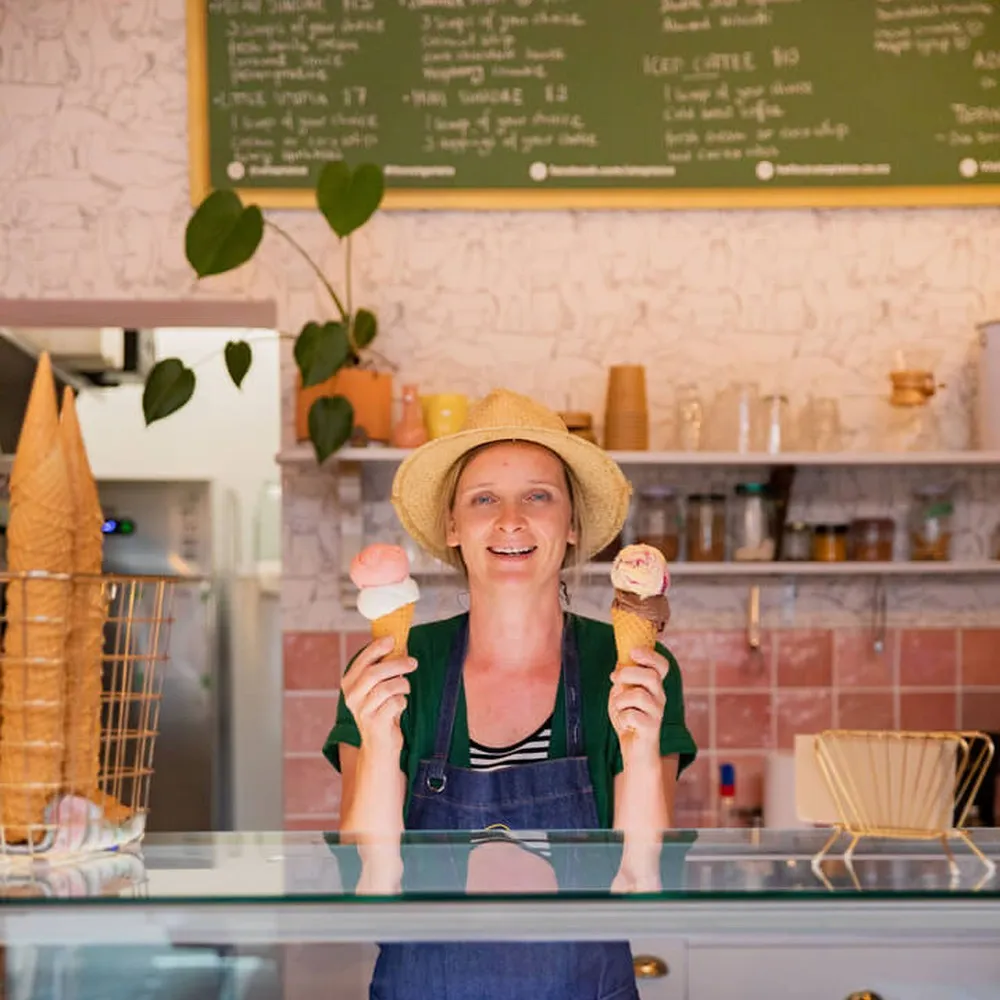 Woman holding two ice creams at Utopia Ice