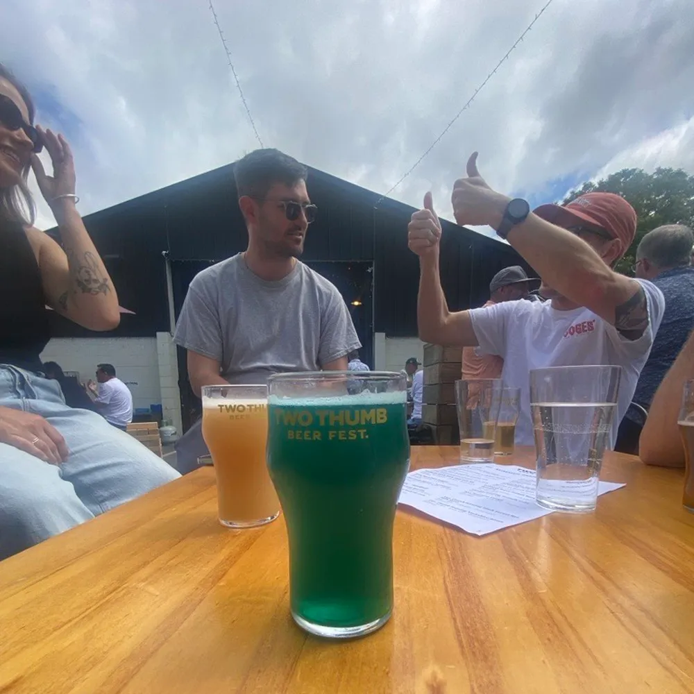 Friends enjoying Two Thumbs Brewery