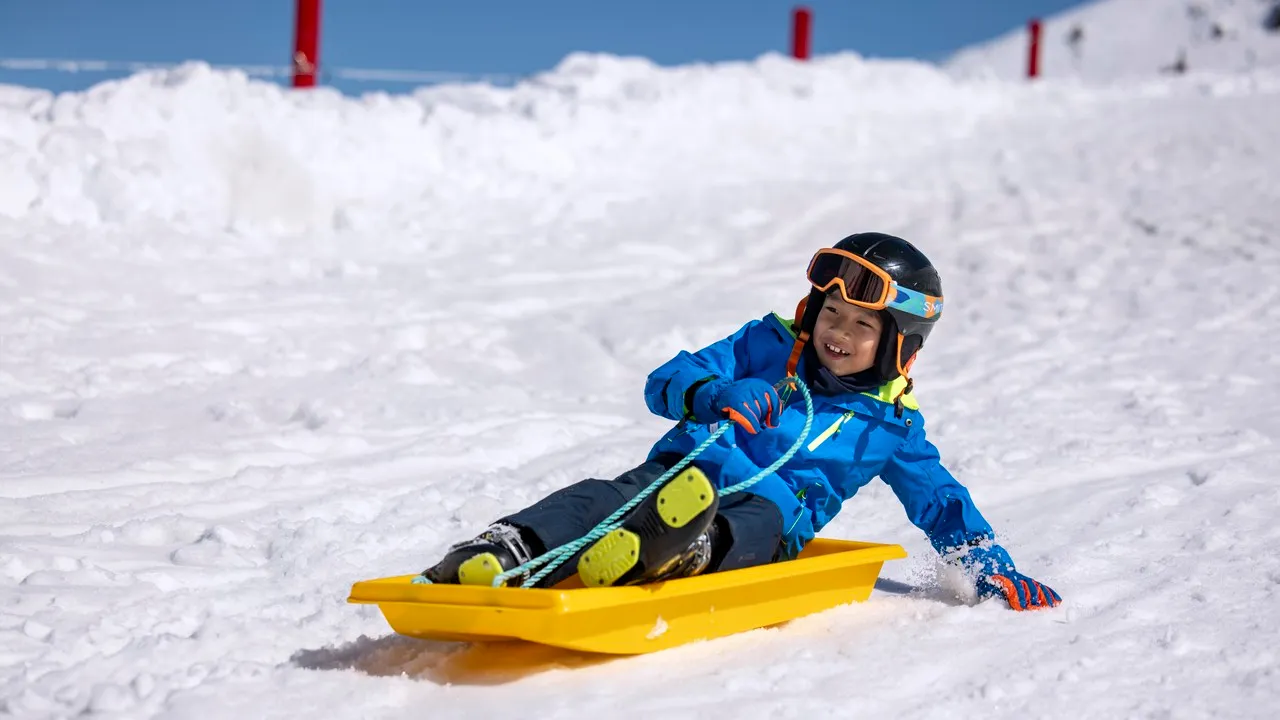 Child tobogganing